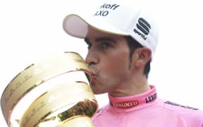 The Spanish cyclist Alberto Contador celebrates winning the Giro de Italia.