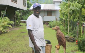 Joe Dutaona, master wood carver outside his studio in Arawa, Bougainville.