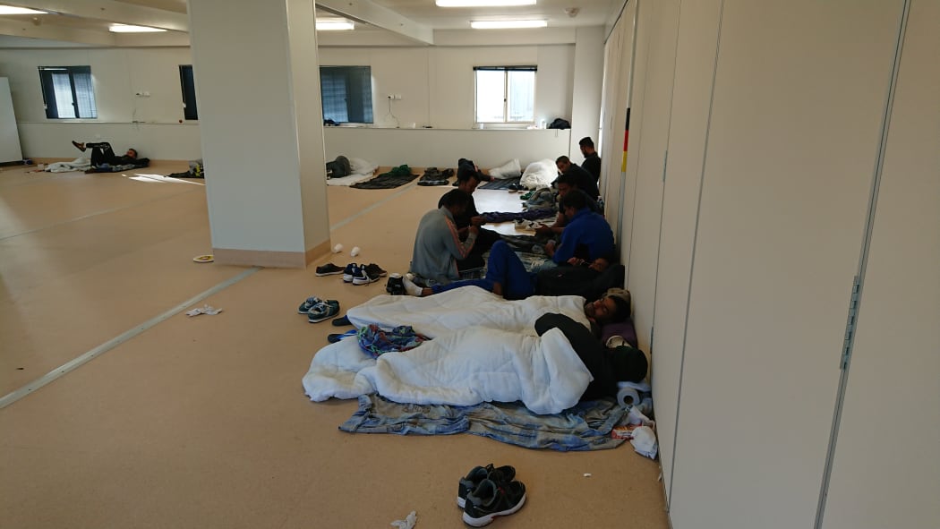 Some New Zealanders in Yongah Hill Detention Centre mess hall where they have been kept since riots.