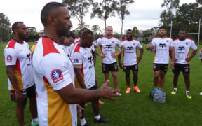Kumuls debutant Tommy Butterfield (2R) and teammates listen in to captain Rod Griffin.