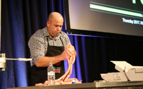 Corey Winder linking sausages