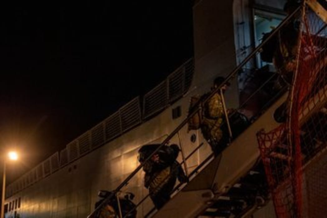 Defence Force personnel board the  HMNZS Canterbury.