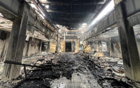 The structure at the main entrance to the parliament building was still standing but the building and its contents were decimated. Photo: Giff Johnson.