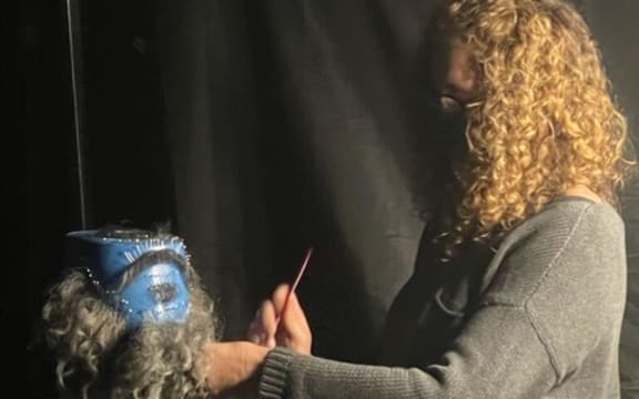 Nancy Hennah, makeup artist, working on a beard for Taika Waititi to wear for Our Flag Means Death