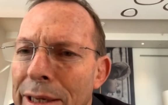 A video grab from footage broadcast by the UK Parliament's Parliamentary Recording Unit (PRU) shows Australian former prime minister Tony Abbott speaking to the Foreign Affairs Committee by remote video feed.