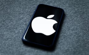 Apple logo displayed on iPhone screen is seen in this illustration photo taken in Poland on February 8, 2021. Facebook reacted negatively to Apple's privacy policy changes.