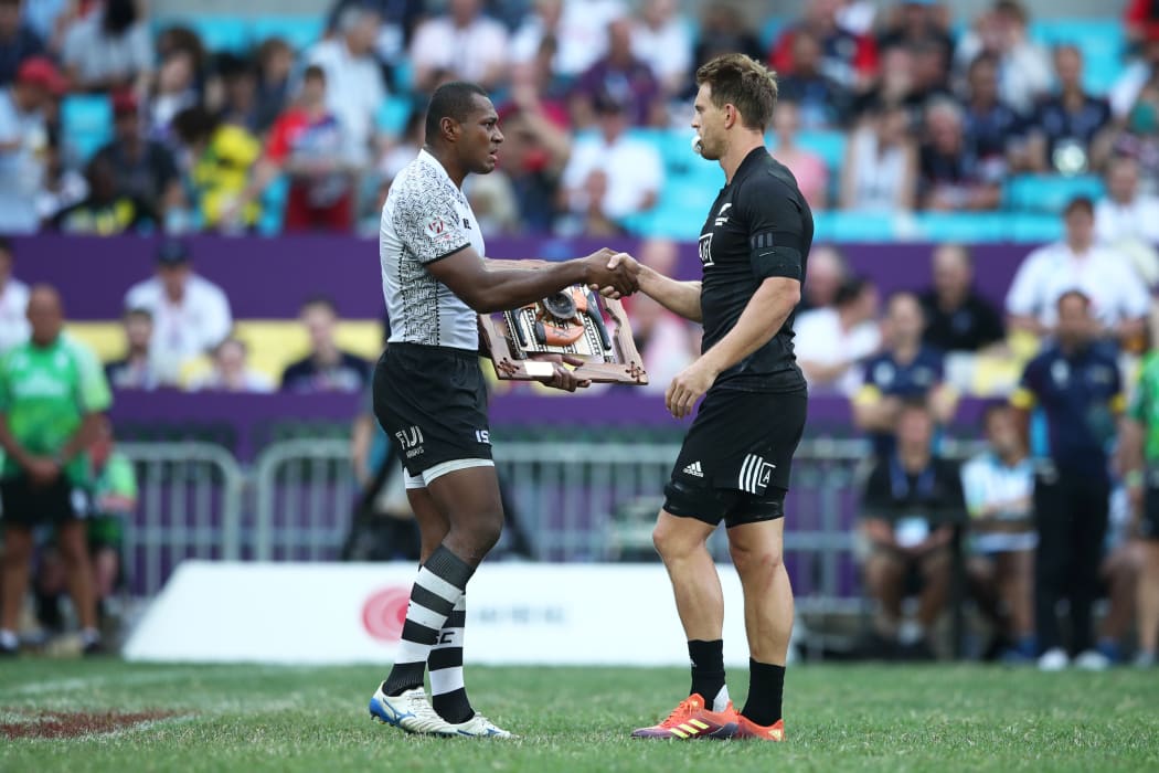 Fiji captain Paula Dranisinukula presents a token of condolences to New Zealand captain Scott Curry in memory of the victims of the Christchurch Mosque shootings.