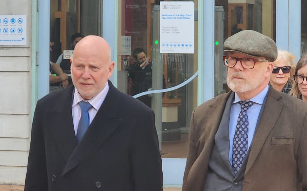 Dr Philip Polkinghorne and his lawyer Ron Mansfield KC leaving court at the end of week 8 of the trial