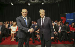 Australia's Prime Minister Scott Morrison (L) and opposition leader Bill Shorten shake hands before the first televised leaders debate in Perth.
