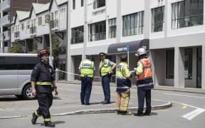 Emergency service outside Tennyson Apartments on Tennyson St, Wellington.  The apartments have been evacuated because of structural damage.