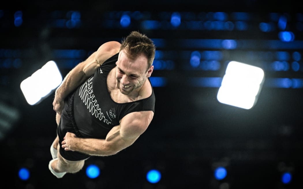 New Zealand's Dylan Schmidt competes in the Men's Trampoline Gymnastics final of the Paris 2024 Olympic Games at the Bercy Arena in Paris, on August 2, 2024. (Photo by Lionel BONAVENTURE / AFP)