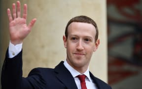 Founder and CEO of Facebook Mark Zuckerberg leaves after a meeting with French President Emmanuel Macron.