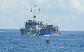 The Royal Solomon Islands Police patrol boat Lata escorts a Vietnamese Blue boat, caught fishing without a license in Rennell and Bellona Province, to the Aola Maritime Base in Honiara. 2017