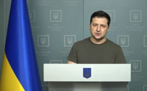 This handout video grab taken and released by the Ukraine Presidency press service on February 26, 2022 shows Ukrainian President Volodymyr Zelensky holding a briefing in Kyiv.