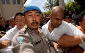 A 2006 file photo shows Myuran Sukumaran (left) and Andrew Chan arriving at Denpasar Court to be sentenced.