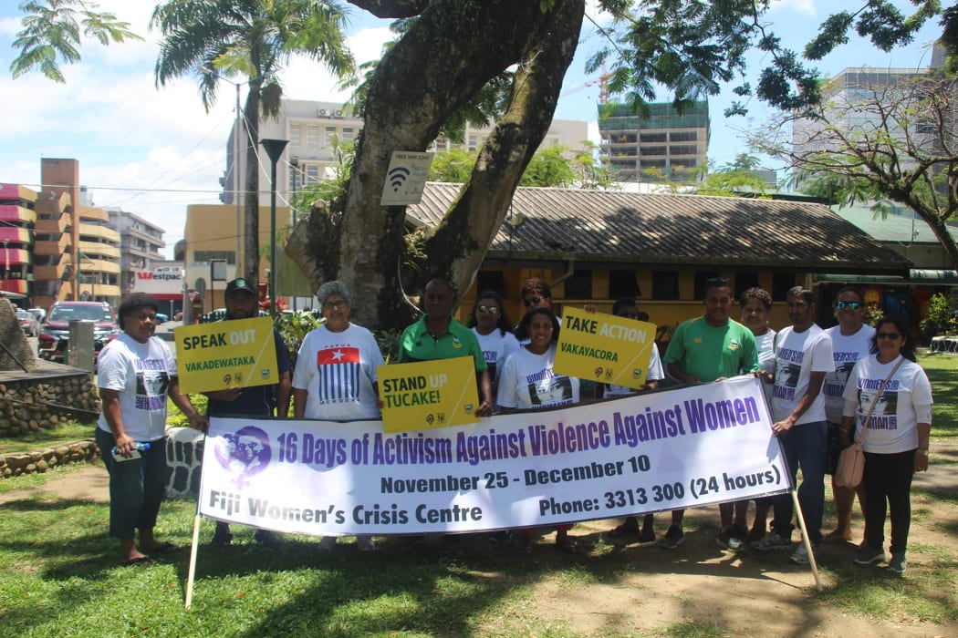 NRL in Fiji staff standing with the Fiji Women's Crisis Centre in support of campaign.