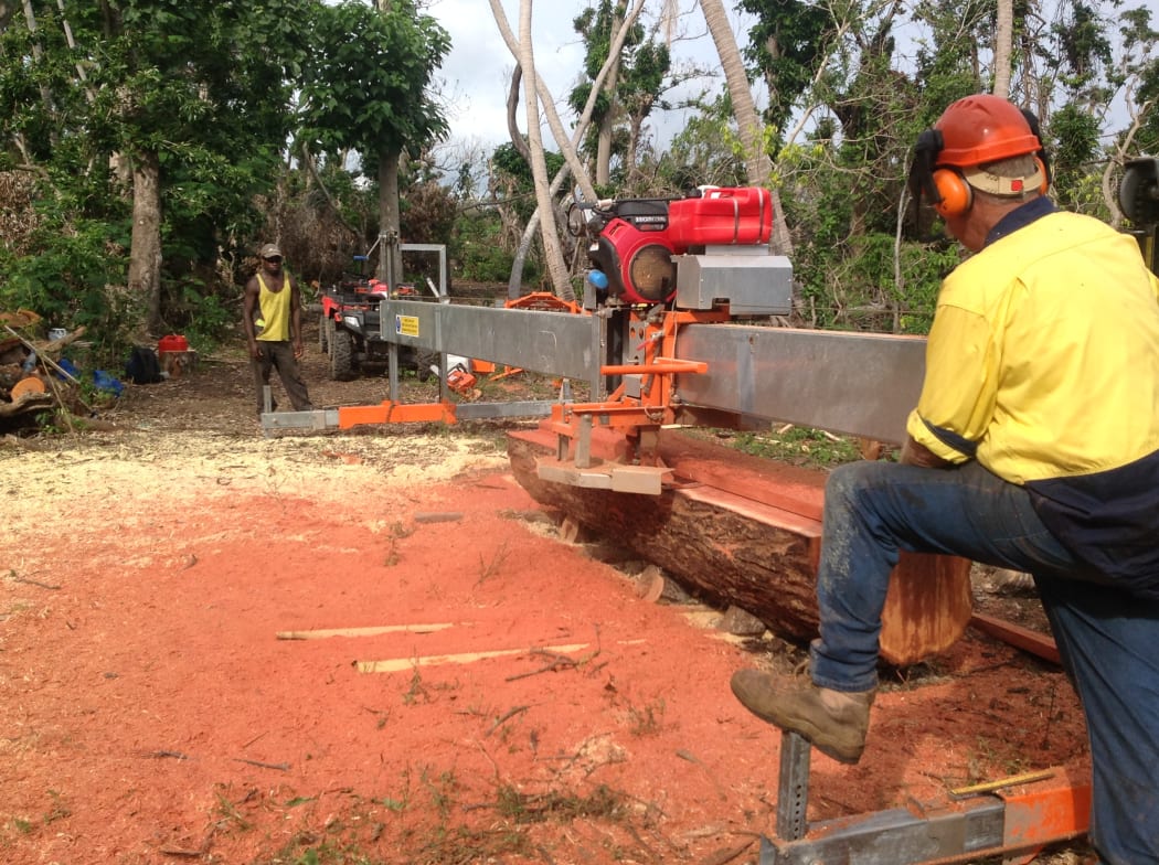 A portable saw mill being used on Tanna in Vanuatu to make lumber from trees blown over by cyclone Pam in March 2015.