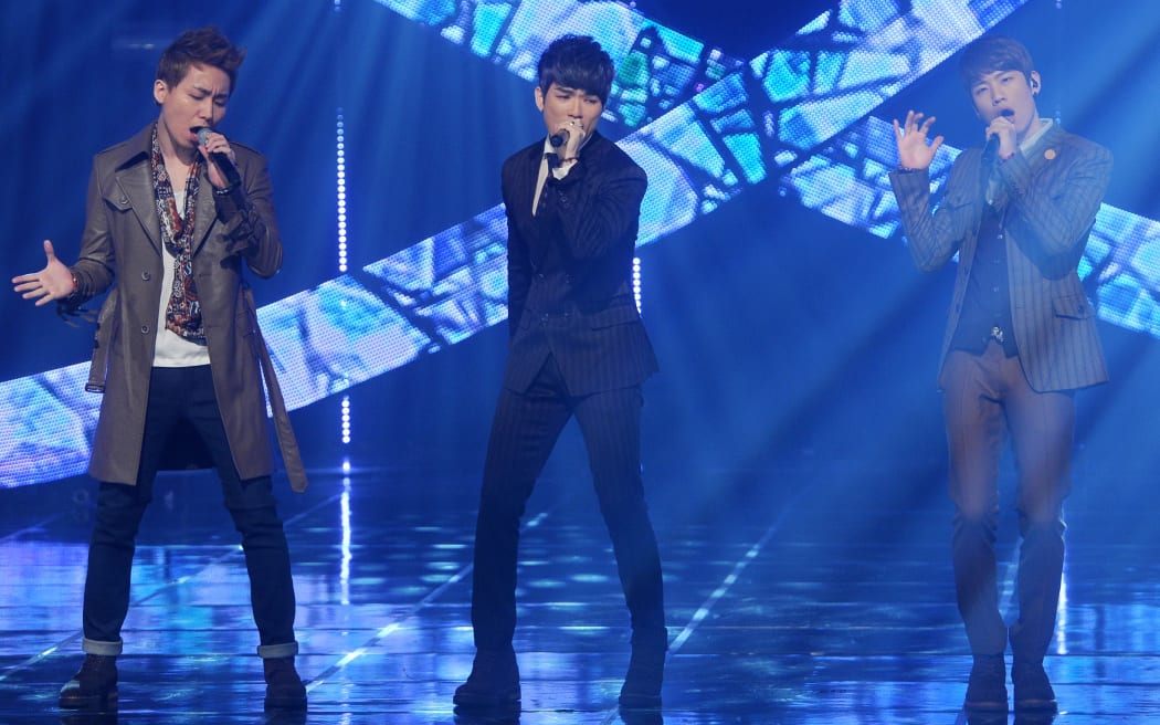 Korean hip-hop trio PHANTOM perform on the stage of 'MNET COUNTDOWN' show at CJ E&M center in Seoul, Korea on January 17, 2013.