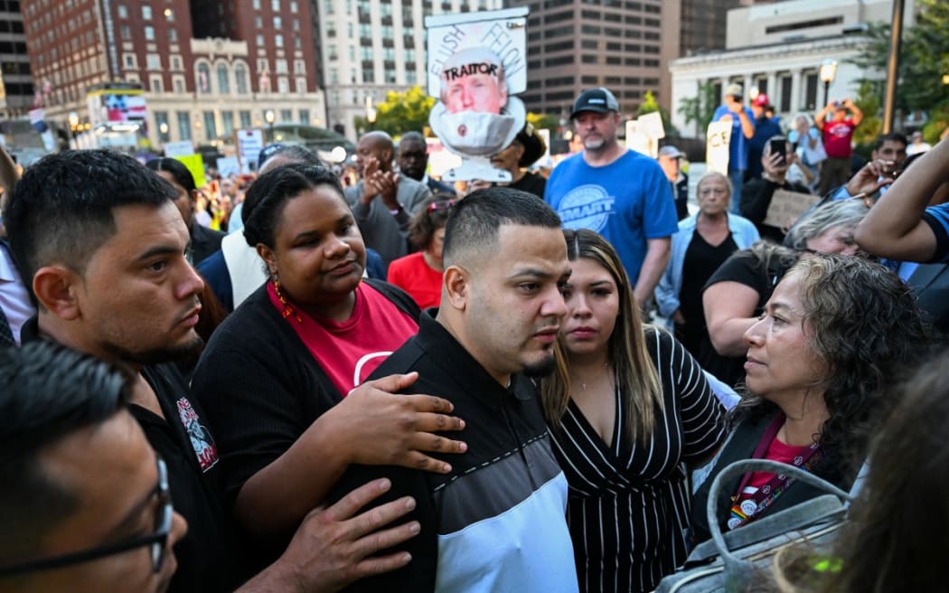 Salvadoran migrant and US resident Kilmar Abrego Garcia walks with his wife Jennifer Vasquez as he arrives at a US Immigration and Customs Enforcement (ICE) field office in Baltimore, Maryland, on August 25, 2025.