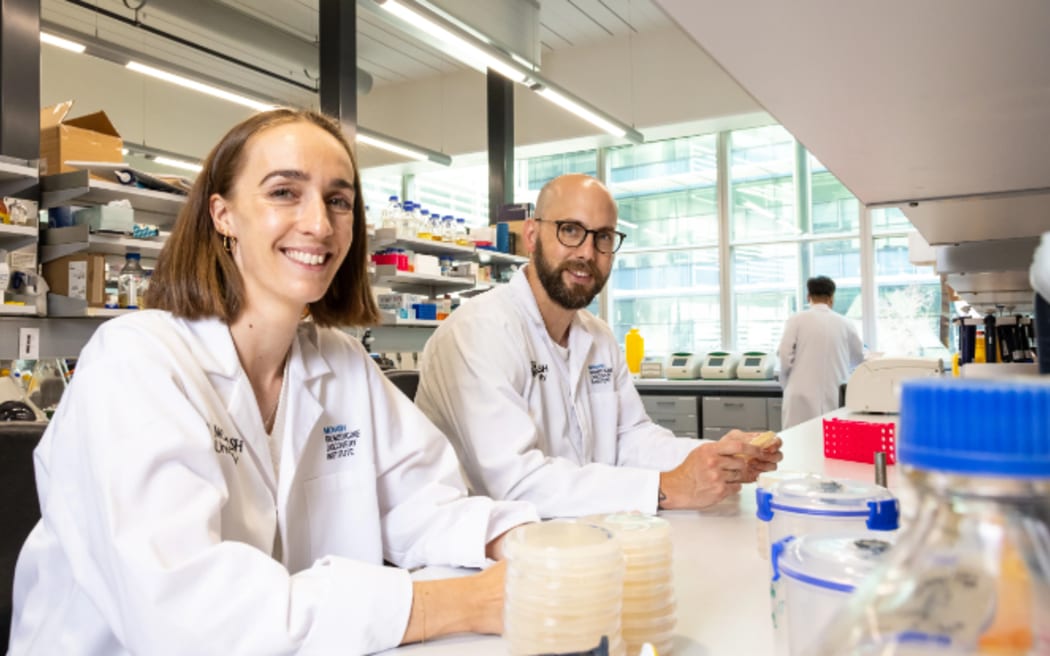 Researchers Ashleigh Kropp and Rhys Grinter, who took part in the study, in the Grinter Lab at Monash University's Biomedicine Discovery Institute.