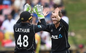 Kane Williamson celebrates with Tom Latham.