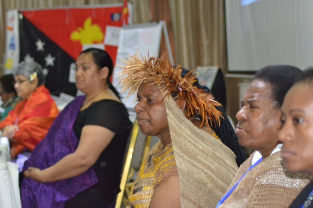 West Papuan human rights activists Rode Wanimbo (centre with headdress), Bernadetha Mahuse (second from right) and Ivana Yohana (right) seen with Merilyn Tahi (left, Vanuatu), Shamima Ali (second from left, Fiji) and Ofa Likiliki (Tonga).