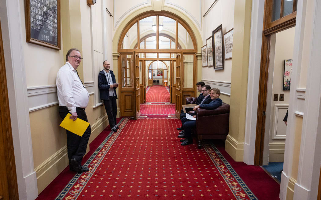 House Advisors and Policy Advisors for various parties wait their turn outside Suze Jones' office.