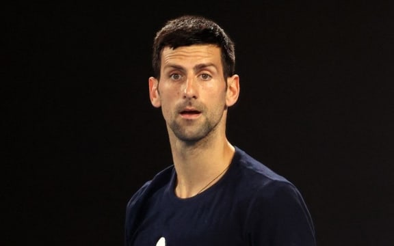 Novak Djokovic of Serbia attends a practice session ahead of the Australian Open tennis tournament in Melbourne on January 14, 2022. (Photo by MARTIN KEEP / AFP) /