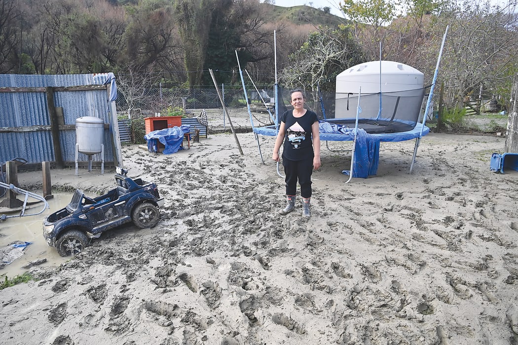 Megan Williams in front of the trampoline where her cat and the neighbour's chickens took refuge.