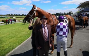 Horse  trainer Cliff Goss with his horse,  Gold Watch. Ridden by Jonathan Riddell after another win