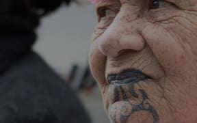 Woman at a breast cancer treatment protest march in Wellington.