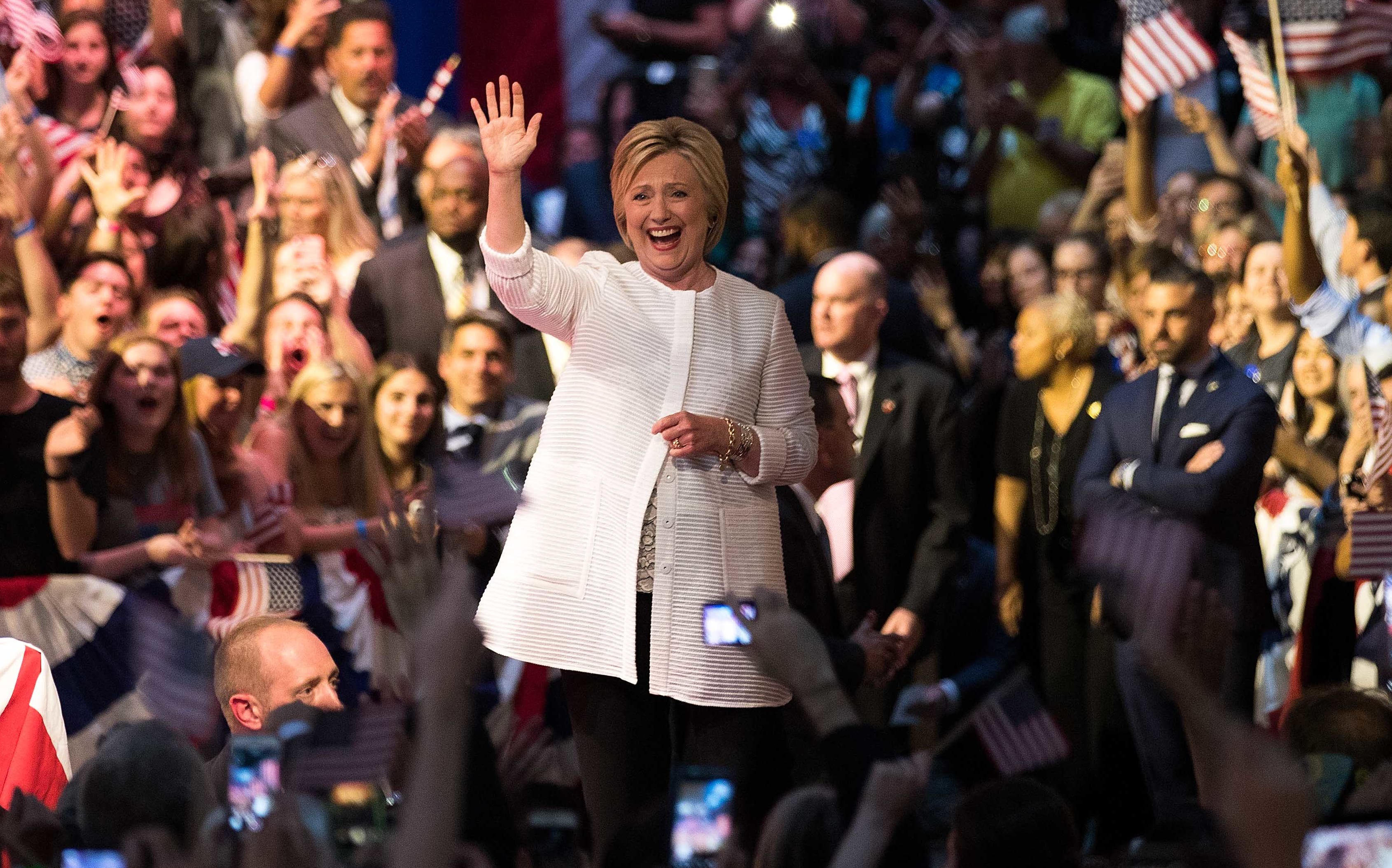 Democratic presidential candidate Hillary Clinton arrives onstage to deliver her victory speech.