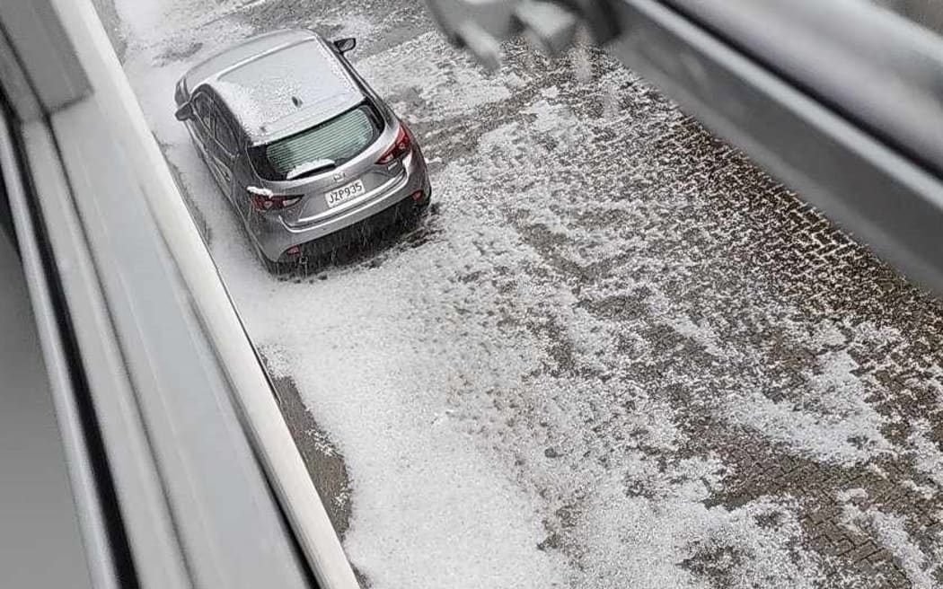 Hail is falling in Wellington's Johnsonville as a severe thunderstorm warning is issued for the city on 12 December 2023.