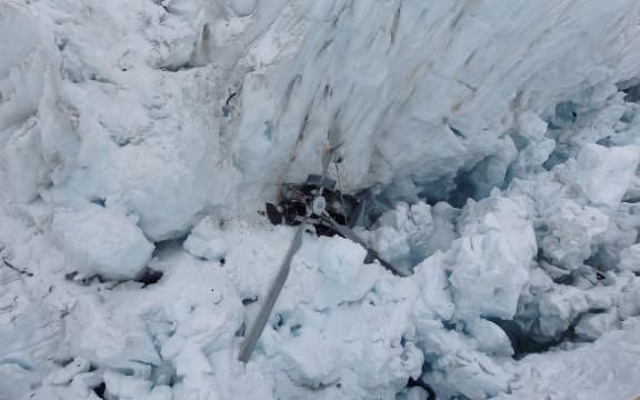 High resolution image of the wreckage of a helicopter on the Fox Glacier in 2015.