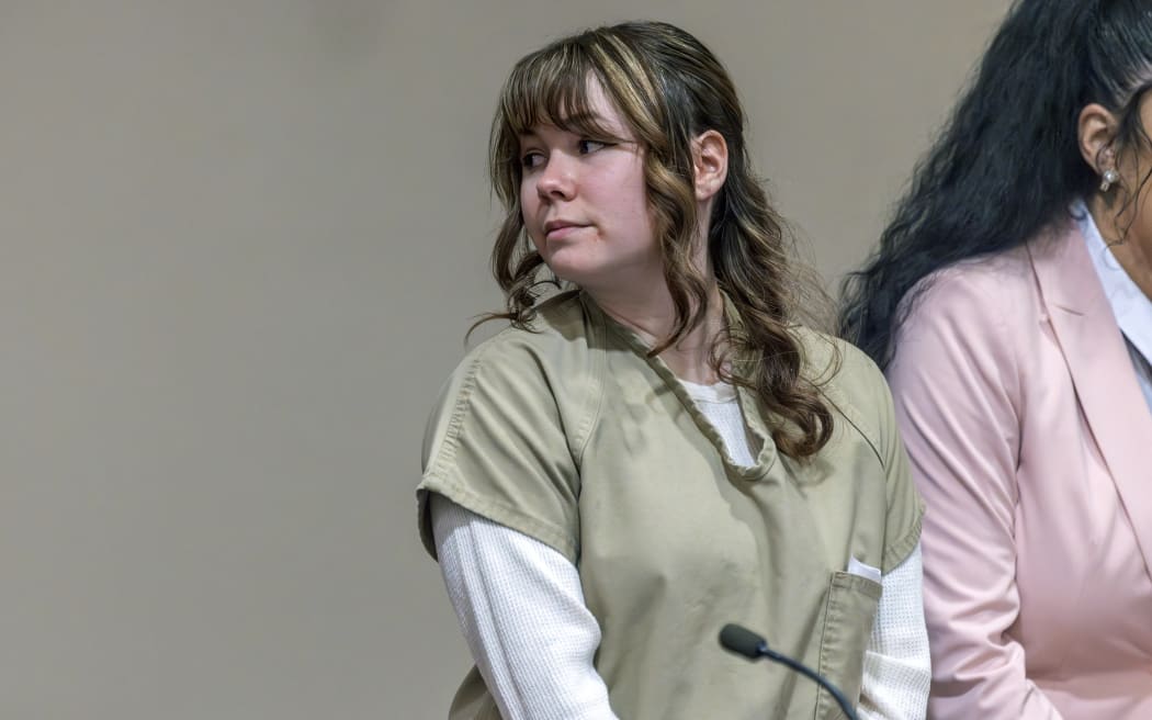 SANTA FE, NEW MEXICO - APRIL 15: Rust armorer Hannah Gutierrez-Reed looks back at her family members at her sentencing at district court on April 15, 2024 in Santa Fe, New Mexico. Armorer on the set of the Western film "Rust,"Gutierrez Reed was convicted by a jury of involuntary manslaughter in the death of cinematographer Halyna Hutchins who was fatally shot by Alec Baldwin in 2021. Gutierrez Reed was sentenced to 18 months in prison.   Luis Sánchez Saturno-Pool/Getty Images/AFP (Photo by POOL / GETTY IMAGES NORTH AMERICA / Getty Images via AFP)