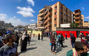 Palestinians gather outside Nasser hospital in Khan Yunis in the southern Gaza Strip on 25 August 2025, following Israeli strikes.