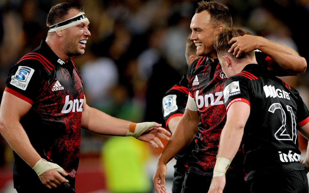 Israel Dagg (r) celebrates with Owen Franks of the Crusaders following their win over the Highlanders.