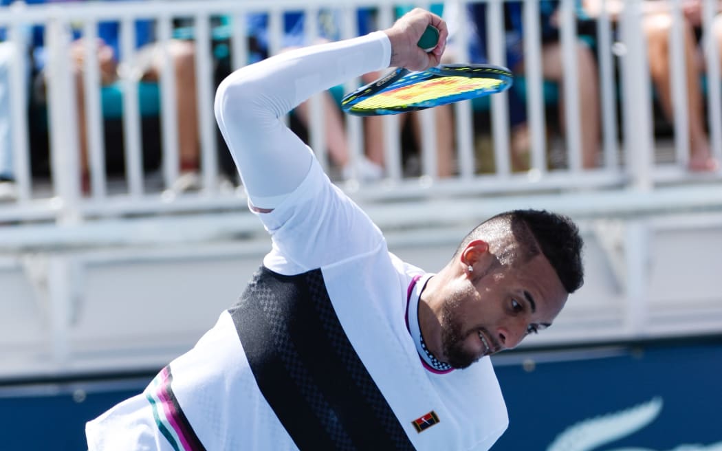 Australian tennis player Nick Kyrgios throws his racquet.