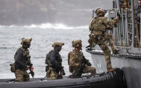 Personnel from the Defence Forces of Australia, Japan, South Korea and the United States, plus officers from the Australian Federal Police and New South Wales Police Force, participate in a boarding exercise as part of training activities for Exercise Pacific Protector 2024, at Sydney Harbour in Sydney on September 26, 2024. - As a founding partner of the Proliferation Security Initiative (PSI), Australia hosted this year's Asia-Pacific training exercise, as part of the participating Indo-Pacific countries’ efforts to impede the illicit-related trade in weapons of mass destruction (WMD). (Photo by DAVID GRAY / AFP)