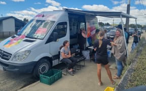 In Waipawa, volunteers dropped in for a sausage, baking, and a bottle of water before they headed off to the next job.