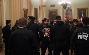 Supporters of US President Donald Trump enter the US Capitol on January 6, 2021, in Washington, DC.