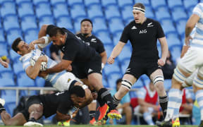 Nepo Laulala of New Zealand All Blacks tackles Pablo Matera of Argentina Pumas.