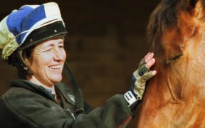 Sheila Laxon pats her Melbourne Cup winning horse Ethereal.