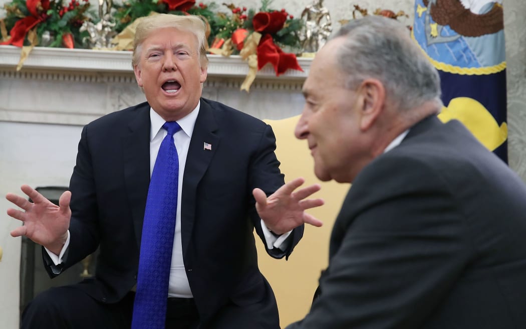 Donald Trump argues about border security with Senate Minority Leader Chuck Schumer in the Oval Office on December 11, 2018 in Washington, DC.