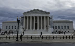 WASHINGTON, DC - DECEMBER 18: Flags fly at half-staff on the front plaza of the U.S. Supreme Court Building before the funeral service for retired Supreme Court Justice Sandra Day O'Connor on December 18, 2023 in Washington, DC. O’Connor, who was the first woman appointed to be a justice on the U.S. Supreme Court, died at the age of 93 on December 1, 2023.   Anna Moneymaker/Getty Images/AFP (Photo by Anna Moneymaker / GETTY IMAGES NORTH AMERICA / Getty Images via AFP)