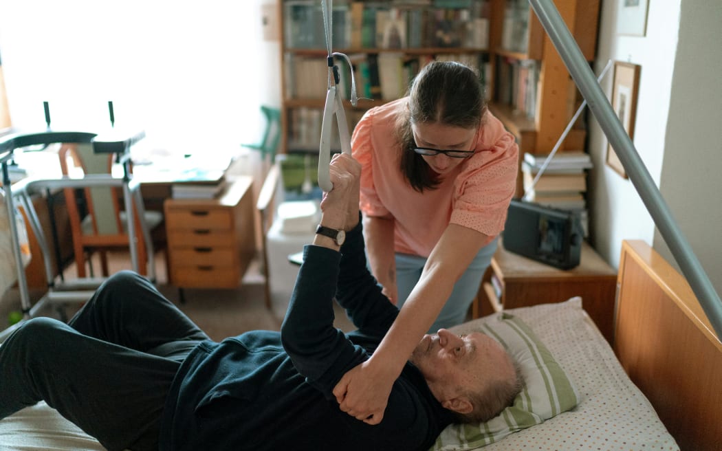 Community support workers assist people who need help with daily living tasks.