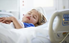 Child in hospital bed