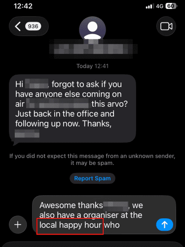 A text message written on a smartphone that autocorrected "local hall" for "local happy hour".