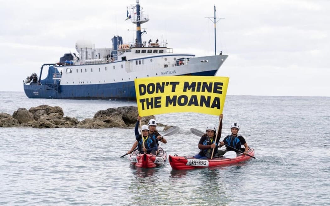 Cook Islands activists confront the EV Nautilus upon its return to Rarotonga, holding banners reading 'Don't Mine The Moana.'