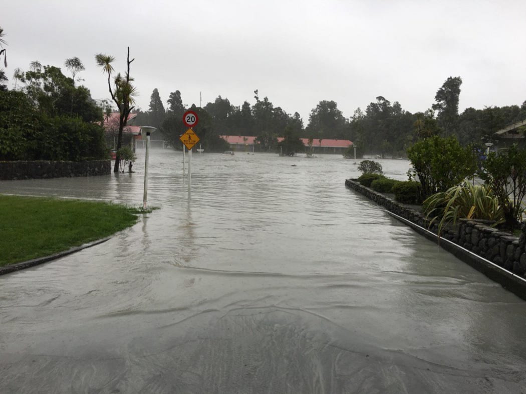 Floodwaters flow through the Scenic Circle Hotel at Franz Josef Glacier.